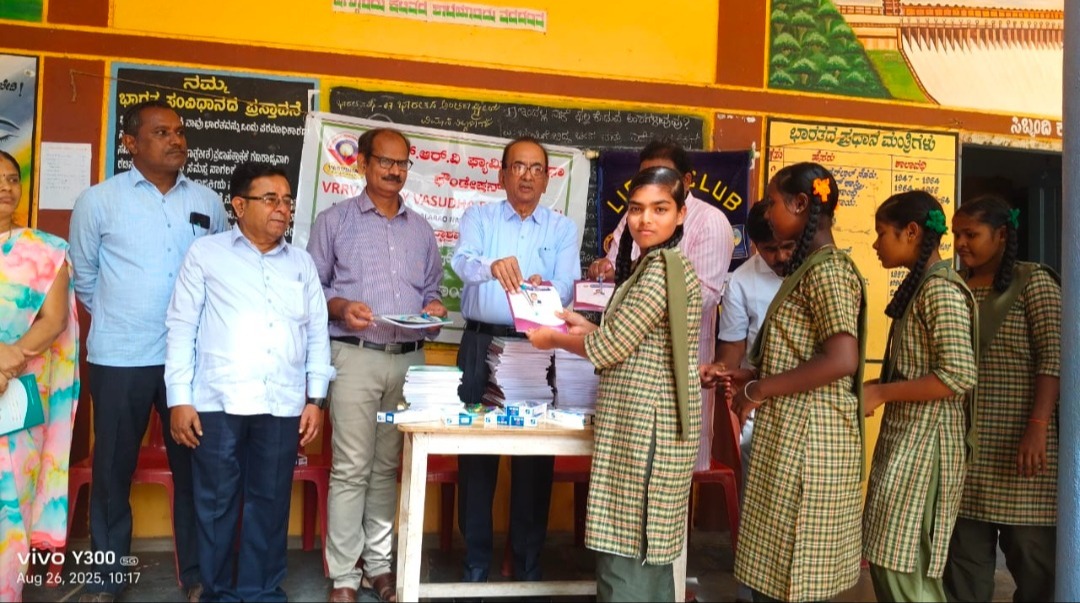 Distribution of pens and notebooks to school children