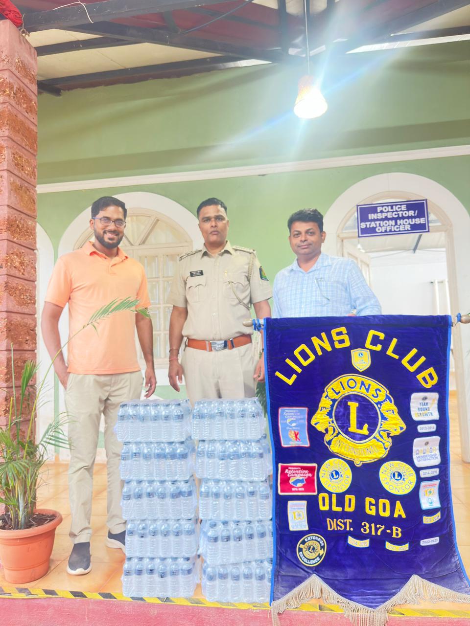 Distribution of water bottles to traffic police during the Feast of St. Francis Xavier