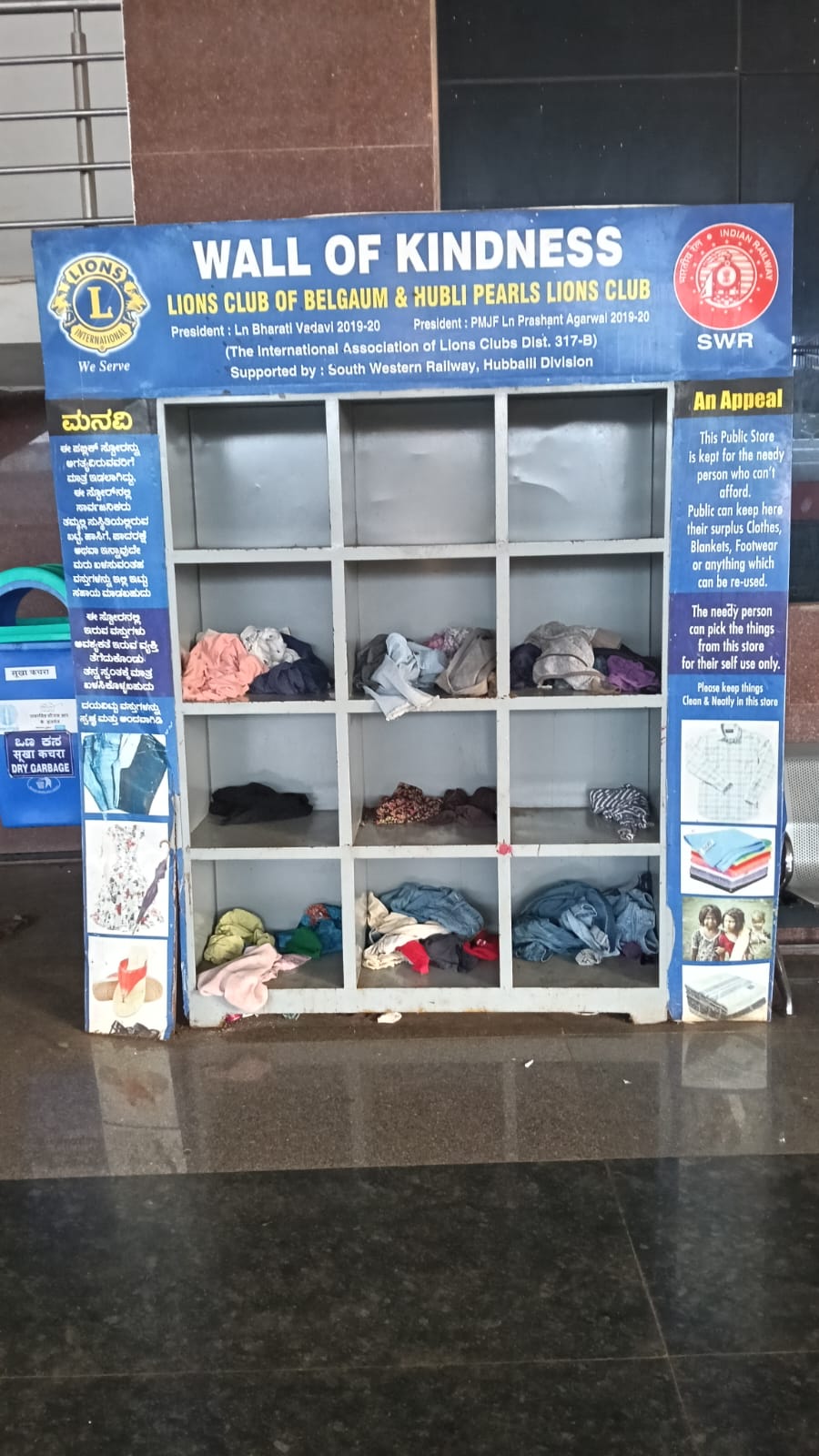 Cleaning and replenishing Wall of Kindness