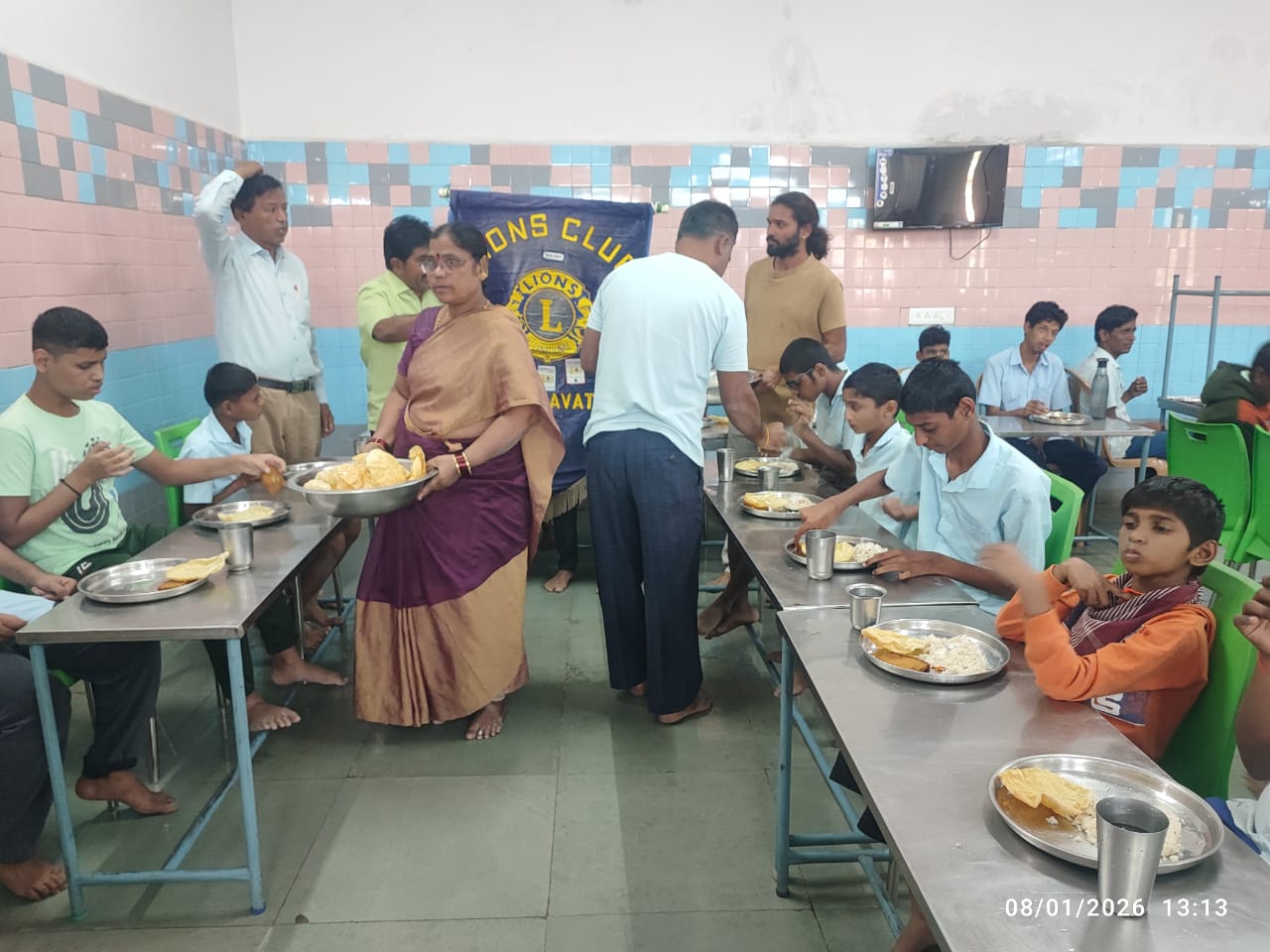 Distribution of food to mentally challenged children