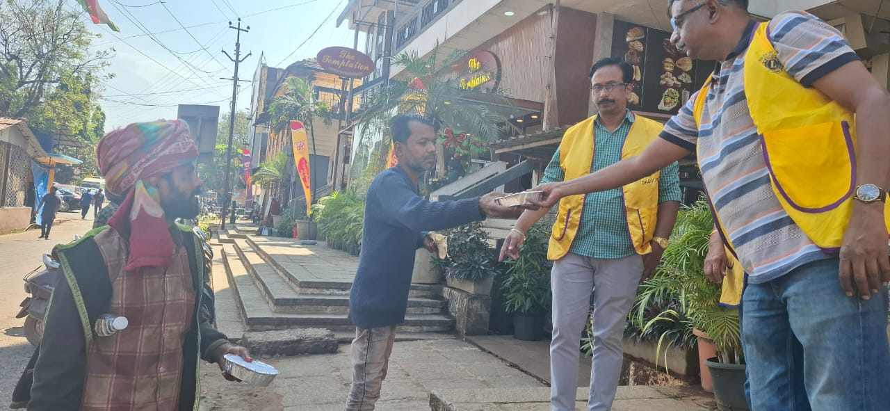 Serving Lunch Packets to the Needy Workers/travellers