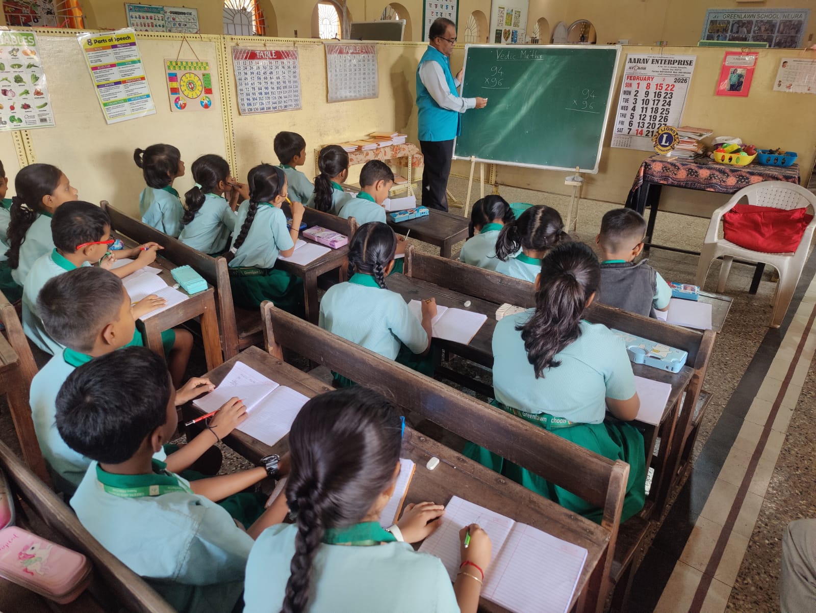 Conducting tutorial class for village students on Vedic Mathematics