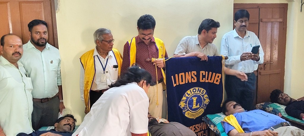 CONDUCTING BLOOD DONATION CAMP.