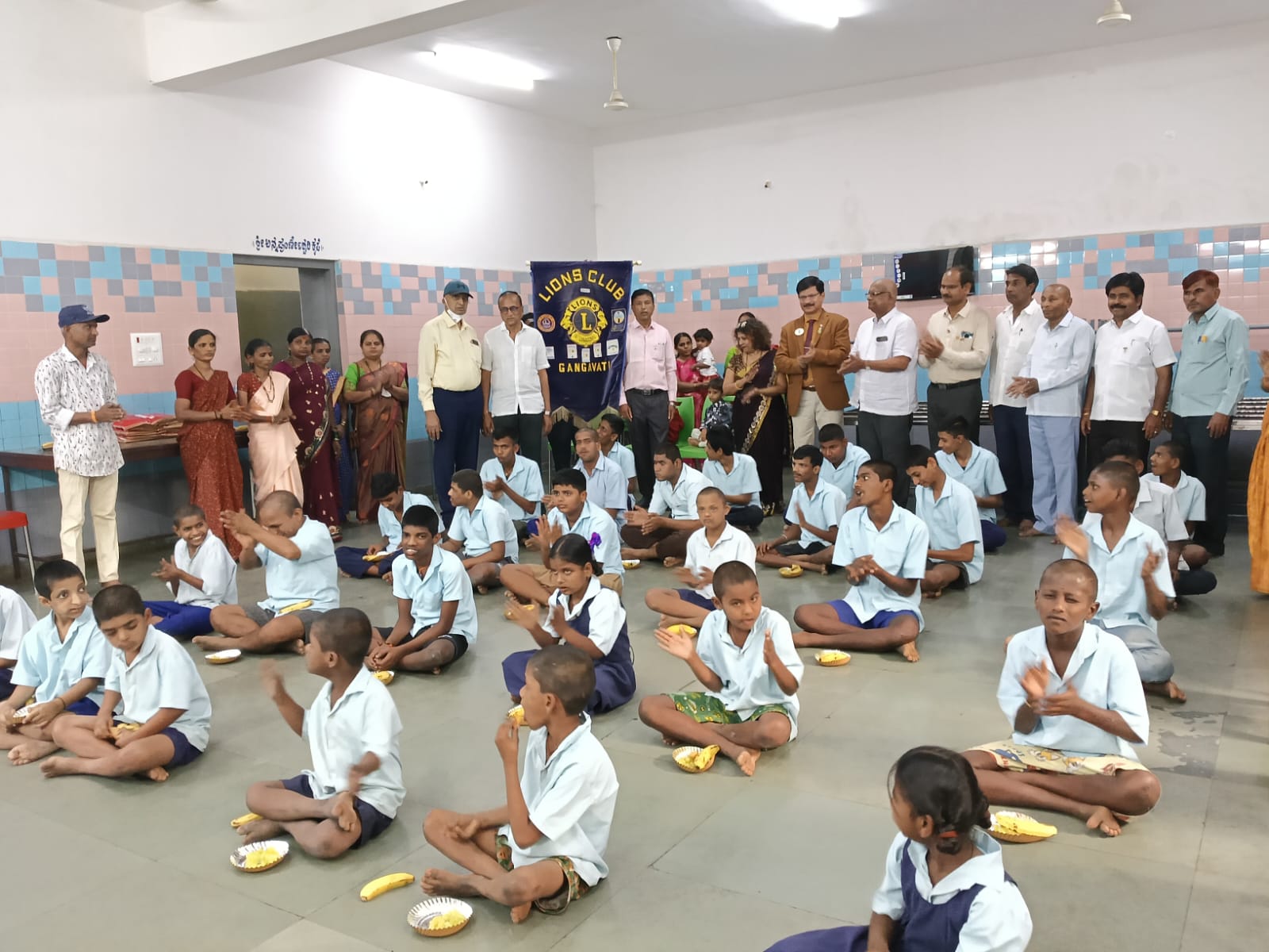 served the prepared food and fruits to mentally retarded school childrens