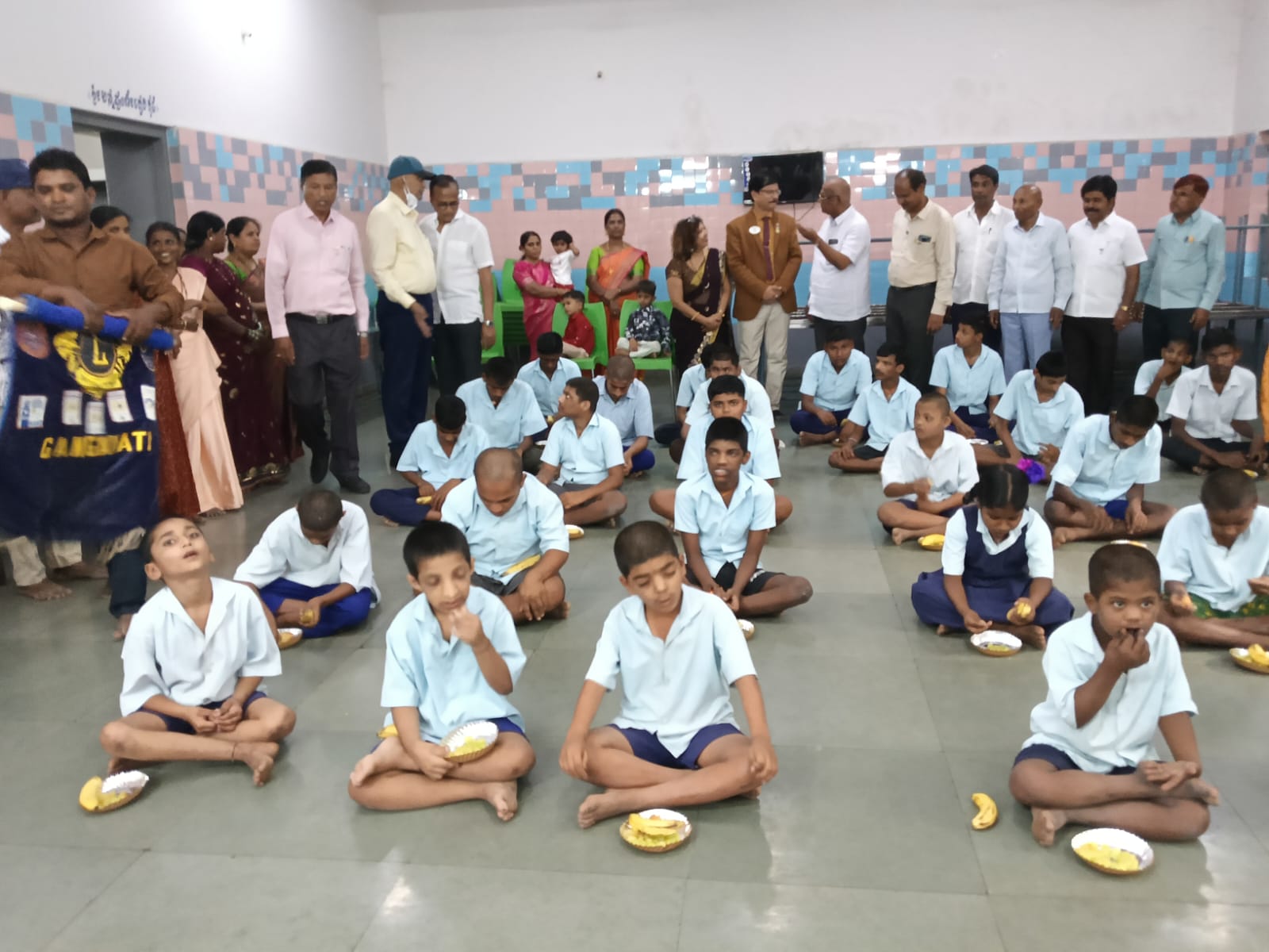 served the prepared food and fruits to mentally retarded school childrens