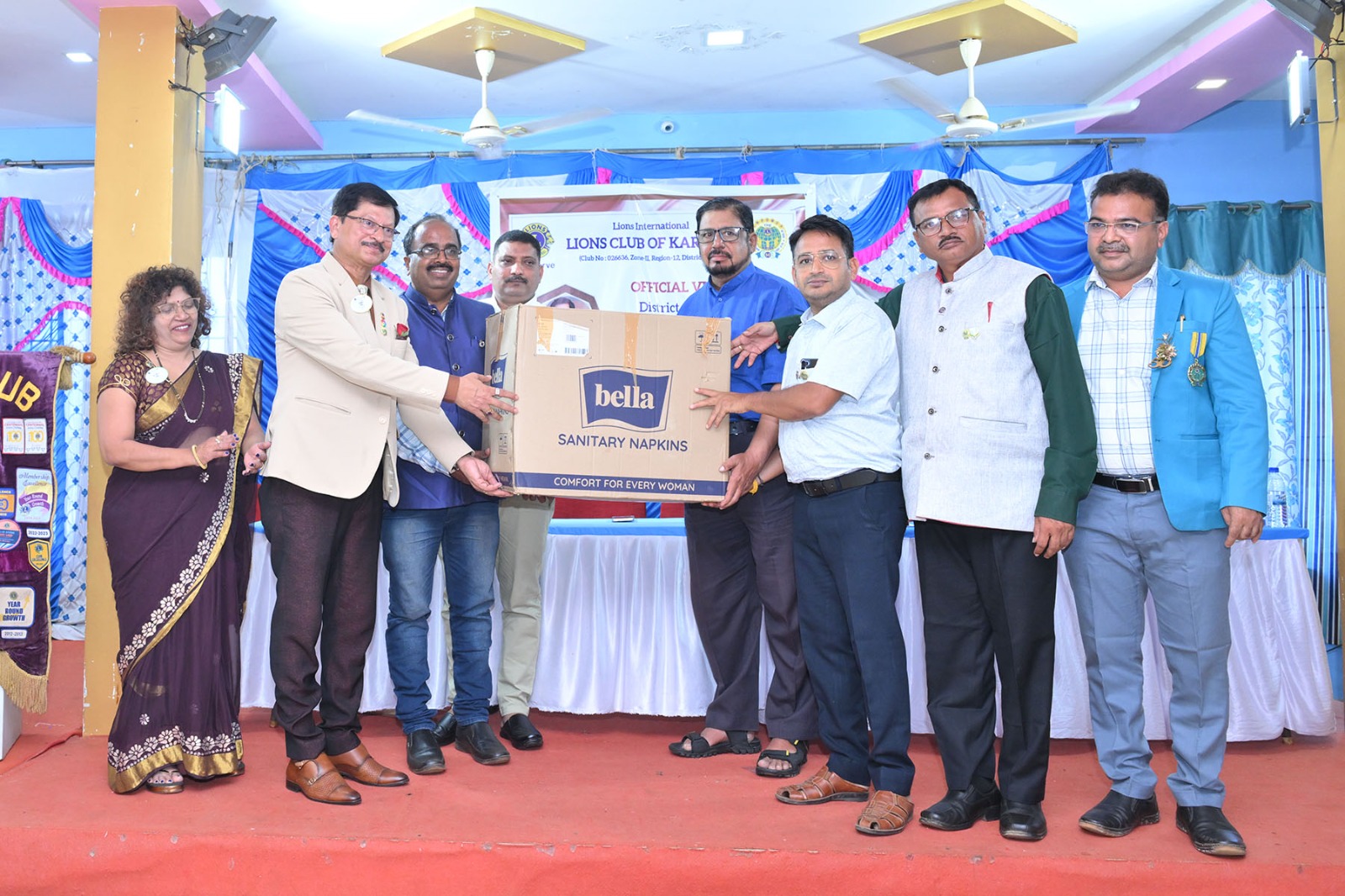 Distribution of saftey napkins to Girls During Lions of Karwar Visit of District Governor