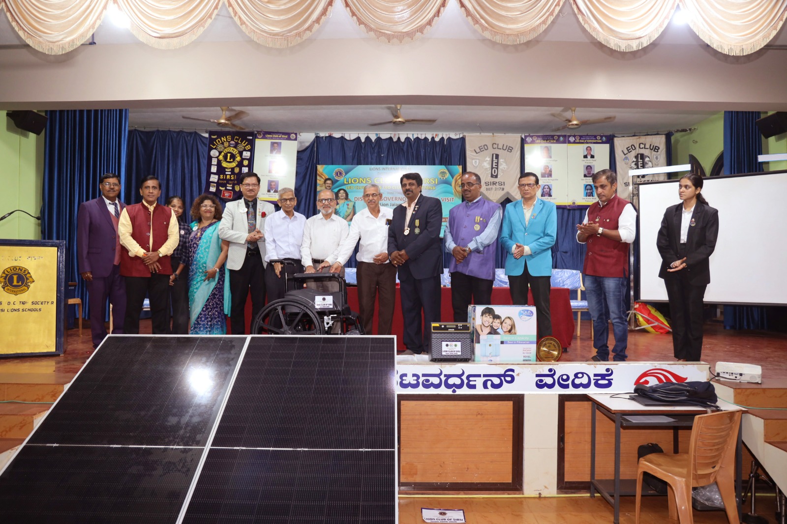 DONATING WHEEL CHAIR TO AMBAGIRI TEMPLE BY LIONS CLUB OF SIRSI DURING THE DG VISIT